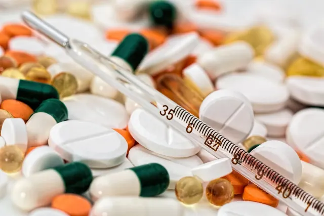 Medicine containers and a thermometer