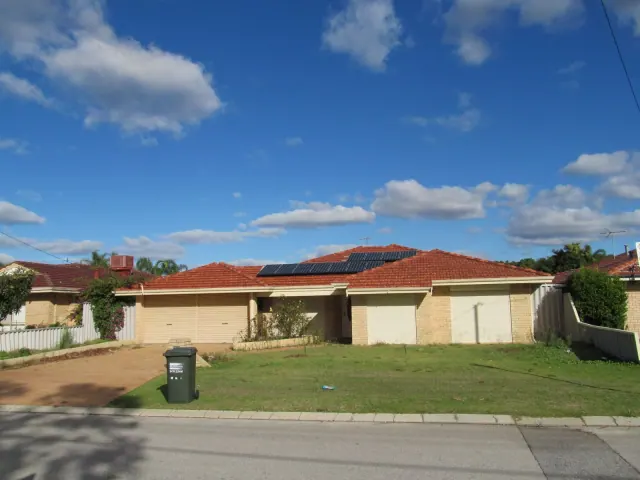 A single-story home with solar panels