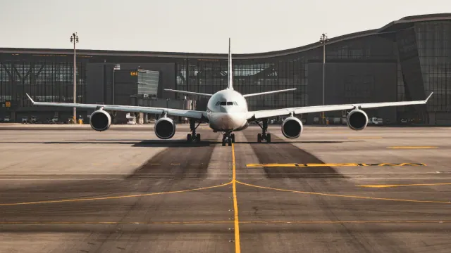 An aircraft parked outside an airport terminal