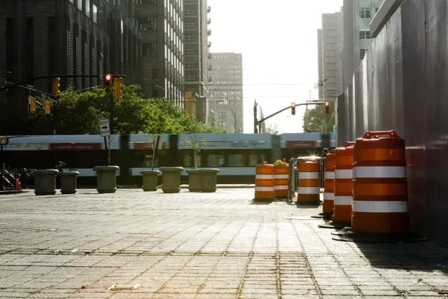A city street with construction barriers