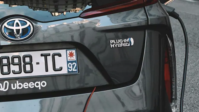 Rear of a Toyota with a plug-in hybrid badge