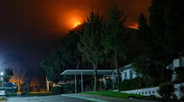 A fire behind a residential building