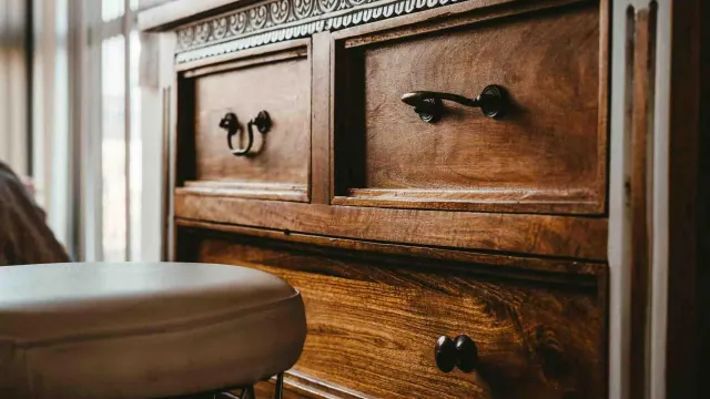 A wooden chest of drawers