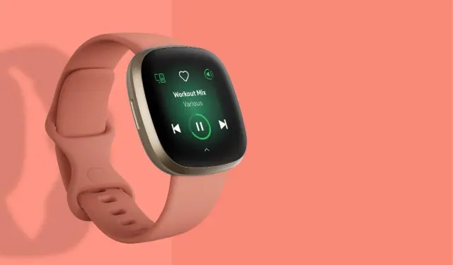 Promotional photo of a Fitbit on a pink background
