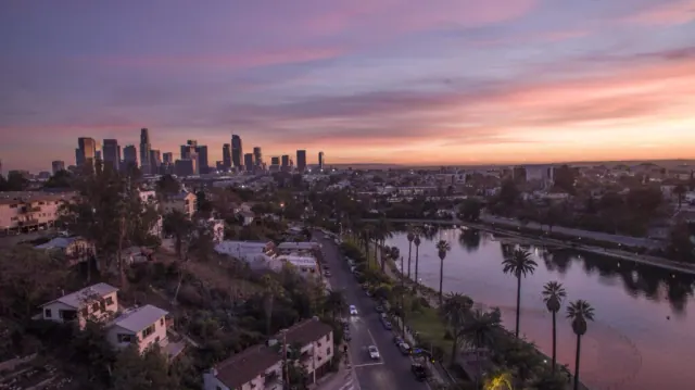 Echo park lake with downtown los angeles skyline at sunset