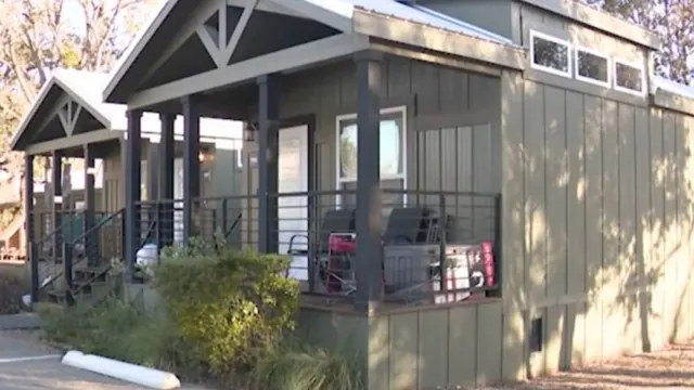 A small home with a covered front porch