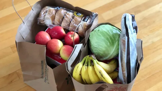 Groceries packed in shopping bags