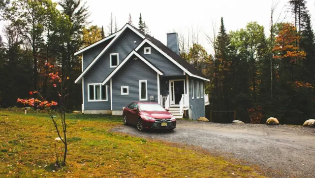 A car parked beside a house