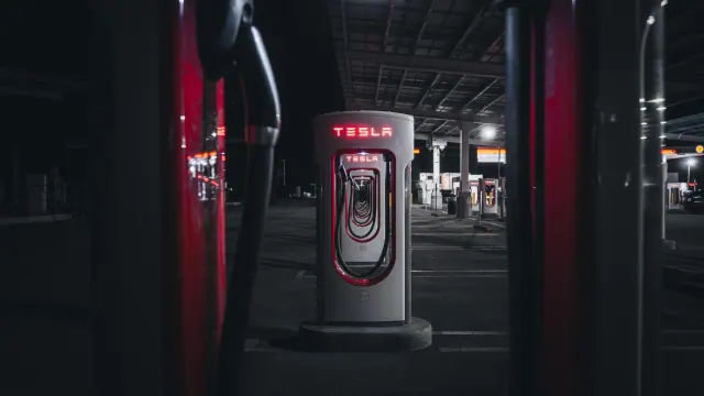 Tesla-branded charging unit at night