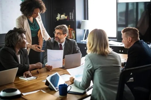People talking across a meeting table