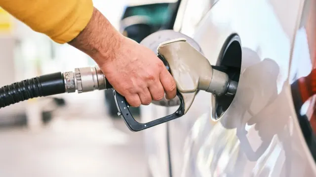 A person filling a car with fuel