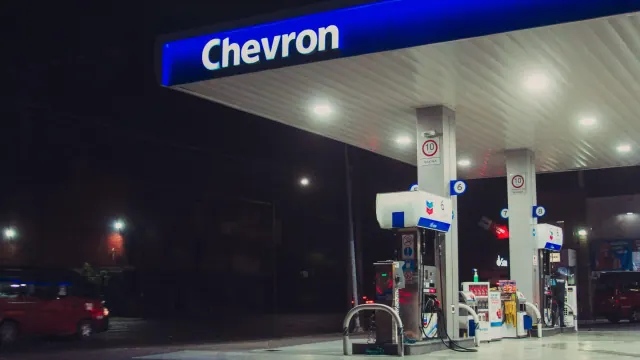 Chevron gas station canopy and pumps at night