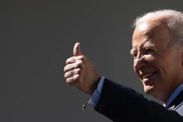 Archival photograph of Joe Biden giving a thumbs-up