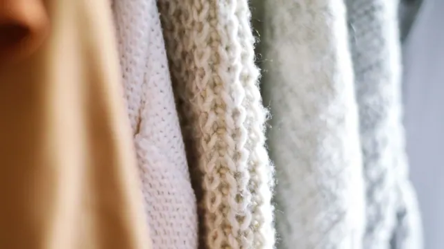 Hanging hand-knit sweaters