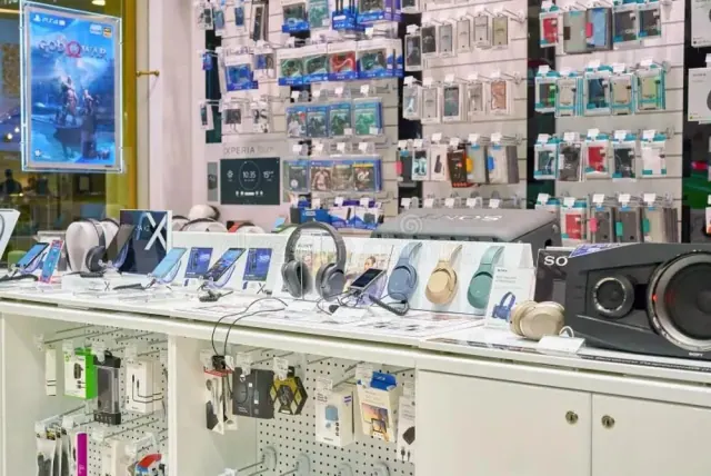 Electronics store displaying headphones, smartphones, tablets, and accessories