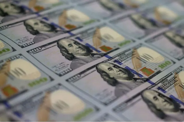 Illustrative photograph of sheets of U.S. currency