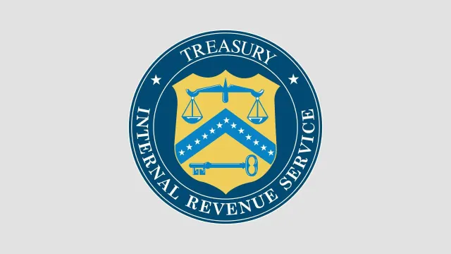 The official seal of the Internal Revenue Service on a grey background