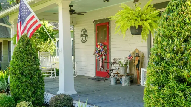 A house entrance with an American flag