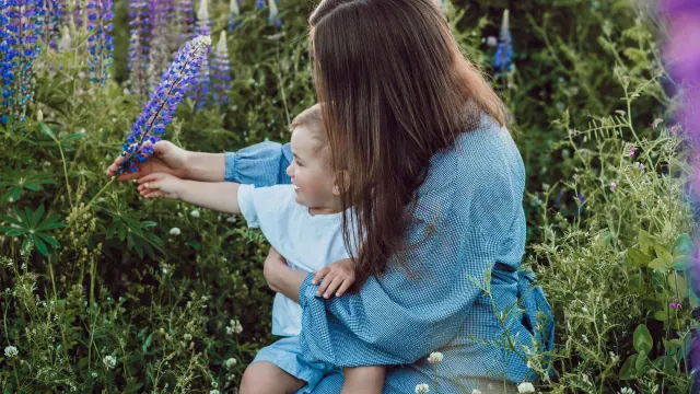 An adult and child exploring outdoors