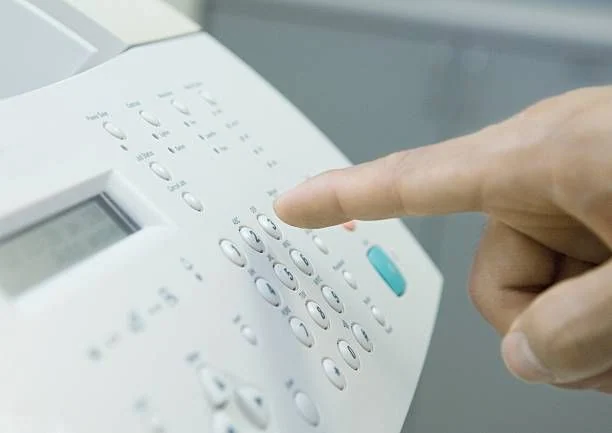 A person using a calculator