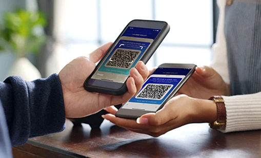 Customer using phone for payment at cafe restaurant, cashless QR code technology and money transfer concept